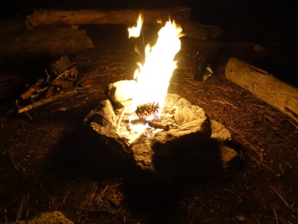 Tonight we're within the legal fire range between 6,000 and 10,000' and have the luxury of an existing fire ring. Dustin tries out a homemade fire starter his uncle made (which works great), and throws in a pine cone for good measure.